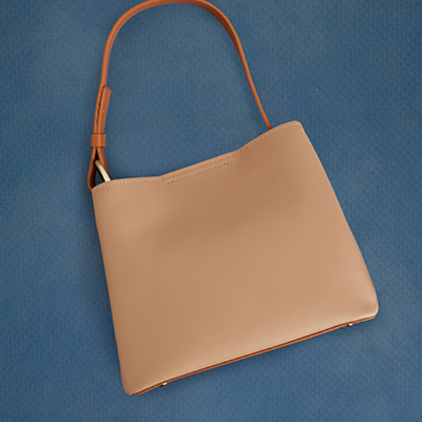 Carry your world with you in handbags and purses that blend practicality with personal style.