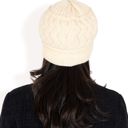 Beige Women's Knitted Newsboy Cap with Braided Cable Pattern and Stylish Brim Design