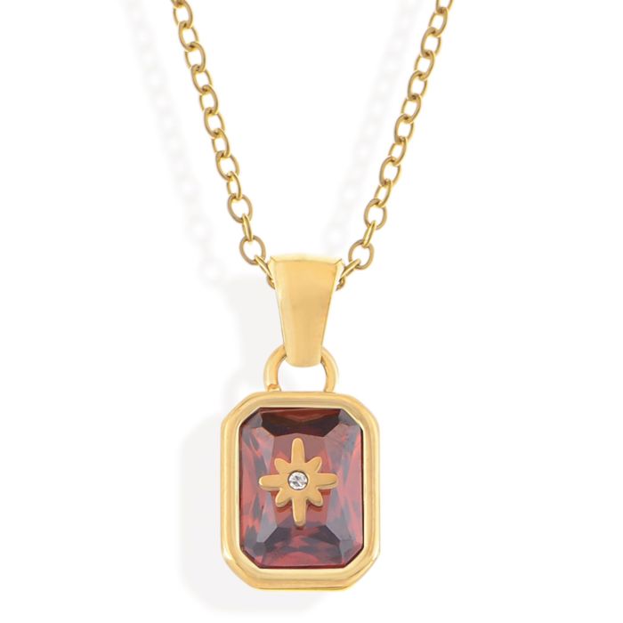 Gold Tone Pendant Necklace with Rectangular Crystal and Starburst Accent