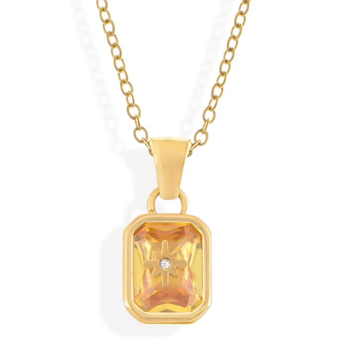 Gold Tone Pendant Necklace with Rectangular Crystal and Starburst Accent