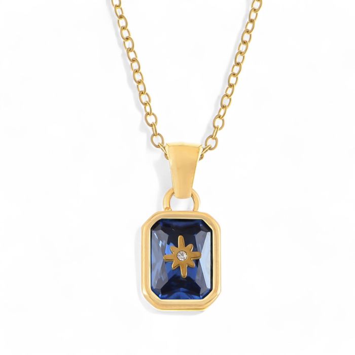 Gold Tone Pendant Necklace with Rectangular Crystal and Starburst Accent