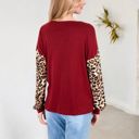  Crisscross V-Neck Top with Leopard Print Sleeves and Relaxed Fit