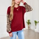  Crisscross V-Neck Top with Leopard Print Sleeves and Relaxed Fit