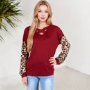  Crisscross V-Neck Top with Leopard Print Sleeves and Relaxed Fit