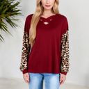  Crisscross V-Neck Top with Leopard Print Sleeves and Relaxed Fit