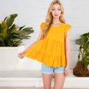  Sleeveless Ruffled Babydoll Top with Tiered Peplum Hem and Crew Neck Casual Loose Fit Blouse