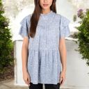  Short Sleeve Babydoll Blouse with Ruffled Hemline and Loose Fit for Effortless Casual Style