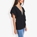  V-Neck Ruffle Sleeve Top with Lace Trim Detail and Asymmetrical Design Casual Blouse