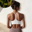 White Medium Women's Low Impact Racerback Sports Bra with Seamless Construction and Breathable Fabric