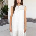 White Medium Sleeveless Eyelet Embroidered Tiered A-Line Dress with Tassel Tie Neckline and Scalloped Hem