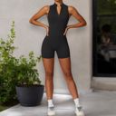 Black Medium Women's Backless One-Piece Activewear Romper with Open Back Design