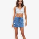  Distressed Denim Mini Skirt With Front Button Detail, Pockets, Raw Hem, And Faded Wash