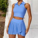 Blue Medium Women's Sleeveless Polo Crop Top with Collared Neckline and Stretch Fabric