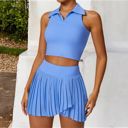 Blue Medium Women's Sleeveless Polo Crop Top with Collared Neckline and Stretch Fabric