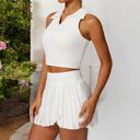 White Small Women's Sleeveless Polo Crop Top with Collared Neckline and Stretch Fabric