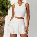 White XL Women's Sleeveless Polo Crop Top with Collared Neckline and Stretch Fabric