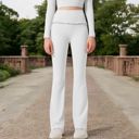 White XL Women's High-Waisted Flare Pants with Ruffle Waistband