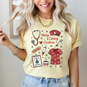 Small Butter Merry And Caring Christmas Comfort Colors Tee, Nurse Holiday Graphic Tee, Christmas Doctor Shirt 
