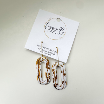 Gold and white dangle earrings 