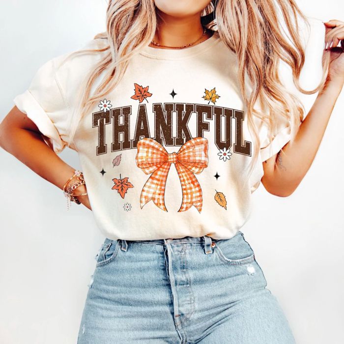 Collegiate Thankful Bow Thanksgiving Fall Autumn - T-Shirt (Crewneck)  100 Cotton Solid Colors Jersey Tee (Unisex)  Bella Canvas, T-Shirt (Crewneck)  Poly-C
