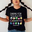  Caring for the Luckiest Little Charms St. Patrick's Day Pediatrics Peds Nurse Soft Cozy Longer Length Unisex Graphic Tee T-shirt