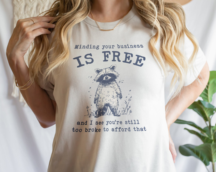 Minding your business is free and i see you're still too broke to afford that. funny Raccoon Wisdom: Mind Your Business Soft Cozy Longer Length Unisex Graphic Tee T-shirt