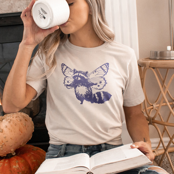 Whimsical Harmony: Raccoon Butterfly Fusion Soft Cozy Longer Length Unisex Graphic Tee T-shirt