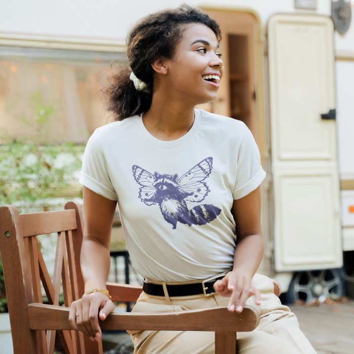 Whimsical Harmony: Raccoon Butterfly Fusion Soft Cozy Longer Length Unisex Graphic Tee T-shirt