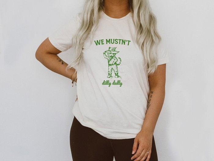 We Mustn't Dilly Dally Puss and Boots Cat Cute Parody Funny Cute Sarcastic Soft Cozy Longer Length Unisex Graphic Tee T-shirt