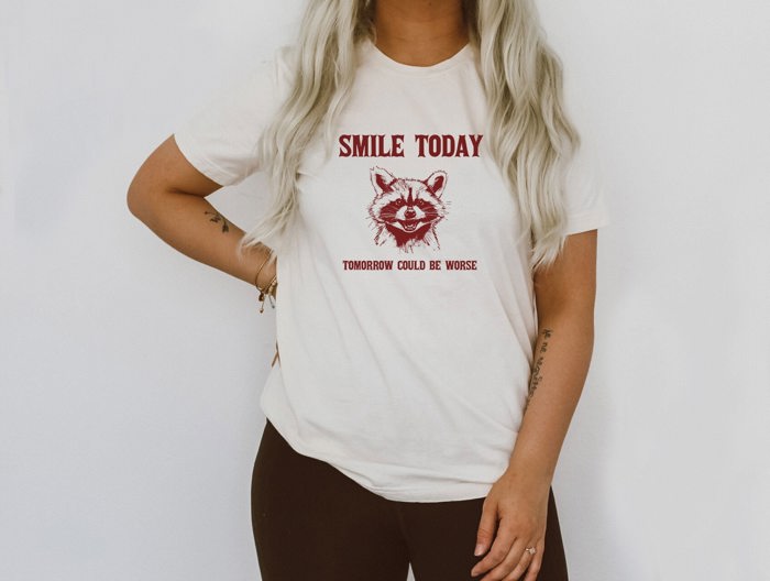 Smile Today Tomorrow Could Be Worse Funny Raccoon Trash Panda Funny Cute Sarcastic Soft Cozy Longer Length Unisex Graphic Tee T-shirt