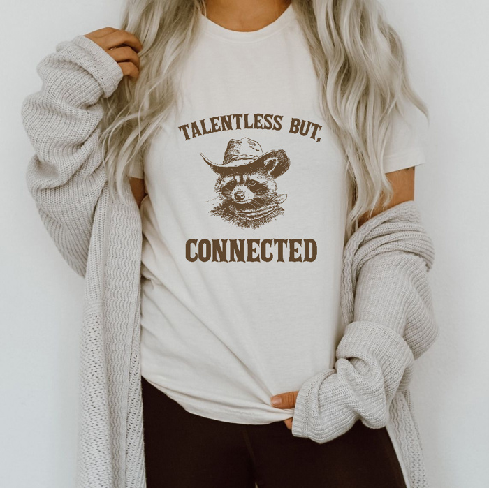 Talentless yet Connected: A Raccoon’s Charm Soft Cozy Longer Length Unisex Graphic Tee T-shirt