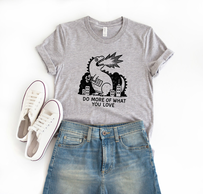 DO MORE OF WHAT YOU LOVE | Unleash Your Passion: A Roaring Reminder to Embrace Joy Soft Cozy Longer Length Unisex Graphic Tee T-shirt