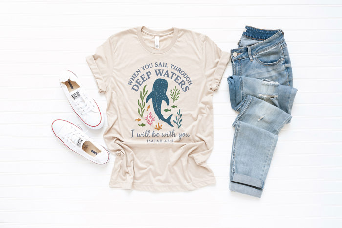 WHEN YOU SAIL THROUGH DEEP WATERS | Guiding Light in Troubled Seas Soft Cozy Longer Length Unisex Graphic Tee T-shirt