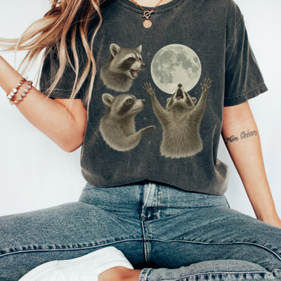 Raccoon Moonlight | Howling to the Moon: A Raccoon's Cosmic Serenade Unisex Heavyweight Comfort Tee