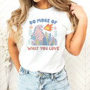 DO MORE OF WHAT YOU LOVE | Unleash the Joy: A Dinosaur's Delight Soft Cozy Longer Length Unisex Graphic Tee T-shirt