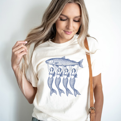 Mermaids Holding a Large Fish | A Catch of Mystical Proportions Unisex Heavyweight Comfort Tee