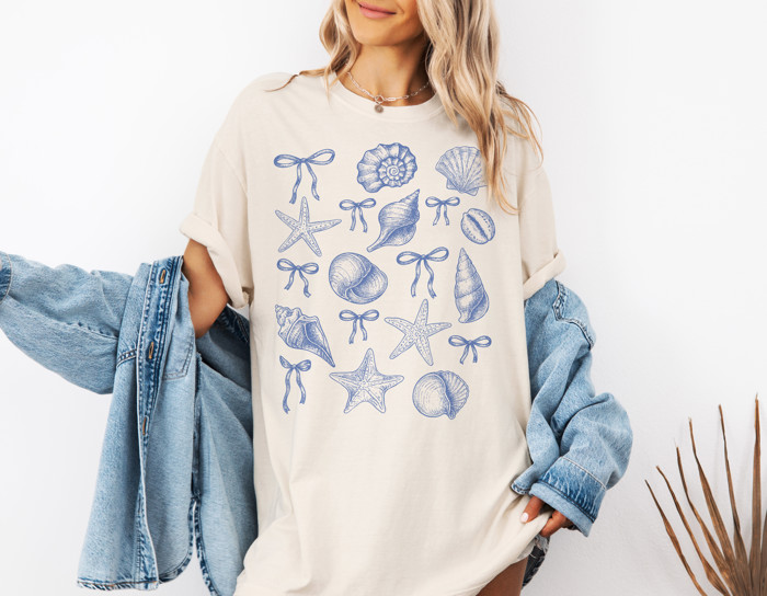 Shells and Starfish with Ribbons | Coastal Elegance: A Nautical Delight Unisex Heavyweight Comfort Tee