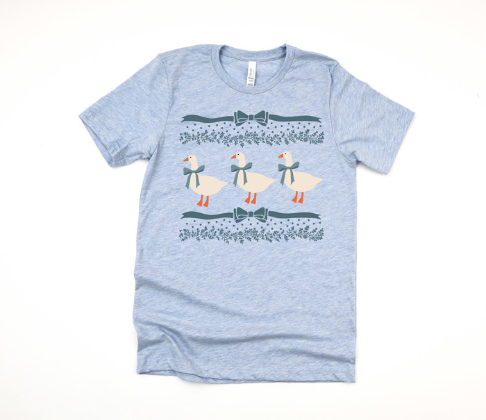 Original 1980's Grandma Blue Ribbon Goose Geese with Bows and Floral Accents | A Charming Parade of Whimsical Geese Soft Cozy Longer Length Unisex Graphic Tee T-shirt