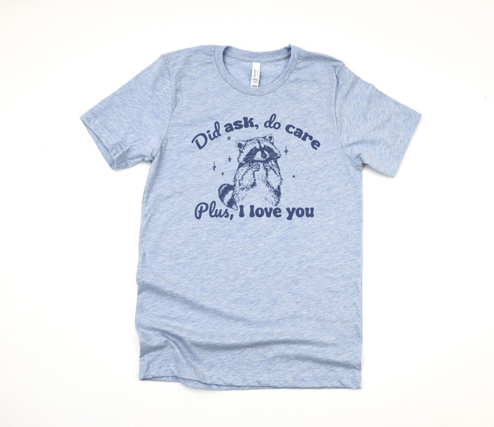 Did ask, do care | Raccoon Love: A Whimsical Reminder of Affection Soft Cozy Longer Length Unisex Graphic Tee T-shirt