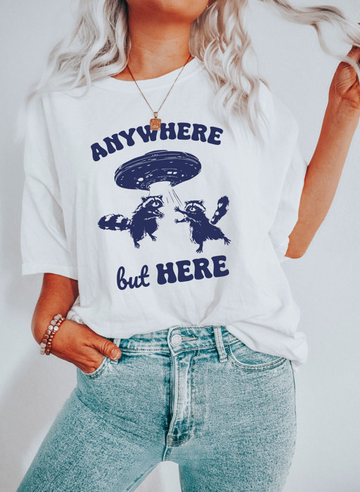 ANYWHERE but HERE | Raccoon Adventures: A Cosmic Escape! Soft Cozy Longer Length Unisex Graphic Tee T-shirt