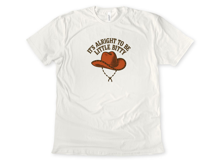 IT'S ALRIGHT TO BE LITTLE BITTY | Small But Mighty: Embrace Your Inner Cowboy Unisex Heavyweight Comfort Tee