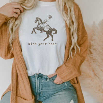 Mind your head | Galloping into the Cowgirl Halloween Spirit! Soft Cozy Longer Length Unisex Graphic Tee T-shirt