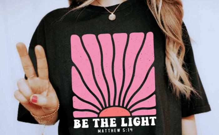 Be the Light Christian Graphic Tee – Matthew 5:14 Bible Verse Inspirational Black T-Shirt