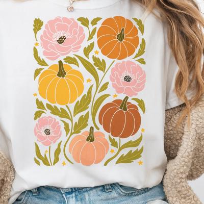 Retro Floral Coquette Pumpkins Graphic Tee – Vintage Fall Aesthetic Shirt with Pink Flowers and Autumn Harvest Vibes