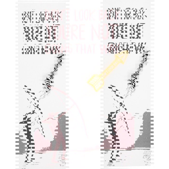 Don't Look Back Arrow Enamel Pin in Gold on Gift Card