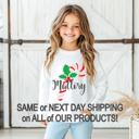  Personalized Candy Cane Christmas Graphic Tee | Holiday Graphic Tee for Girls | Festive Kids Apparel | Girls Personalized Long Sleeve Tee