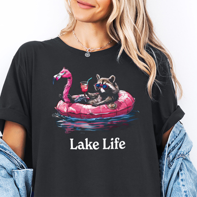 Raccoon & Flamingo Floaty Funny Lake Life Summer Feral Animal Graphic Tee | Summer Tee