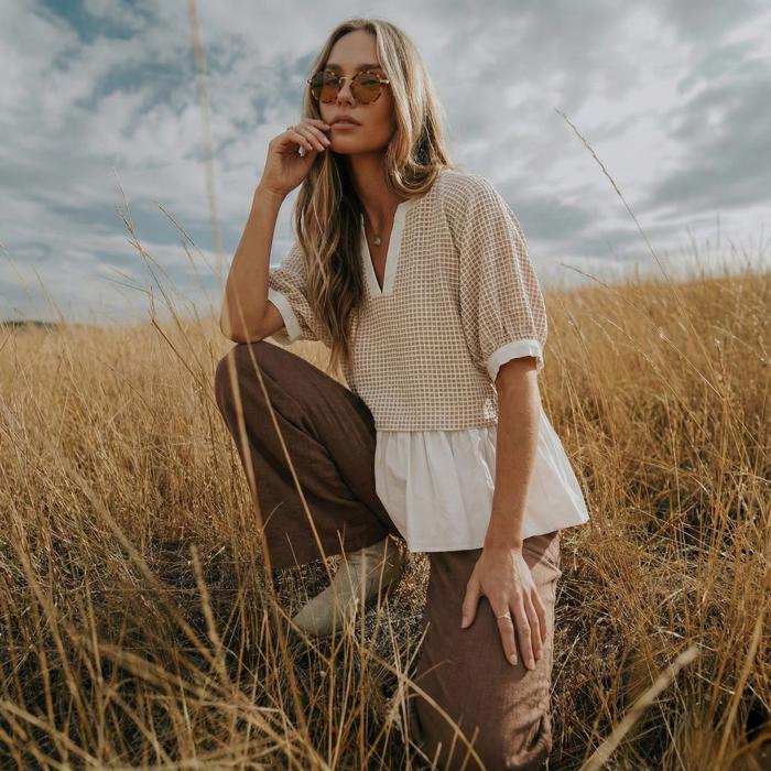 Layered Peplum Top with Textured Grid Overlay Soft Lightweight Fabric Flowy Contrast Hemline Short Gathered Sleeves and Flattering V Neckline