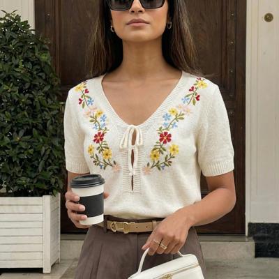Embroidered Knit Top with Floral Detailing Tie Front V Neckline Soft Lightweight Feel Short Sleeves and Feminine Relaxed Silhouette Perfect for Casual Outings Brunch and Effortless Everyday Style
