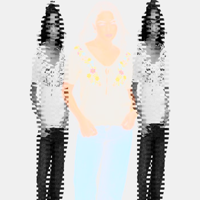 Embroidered Knit Top with Floral Detailing Tie Front V Neckline Soft Lightweight Feel Short Sleeves and Feminine Relaxed Silhouette Perfect for Casual Outings Brunch and Effortless Everyday Style